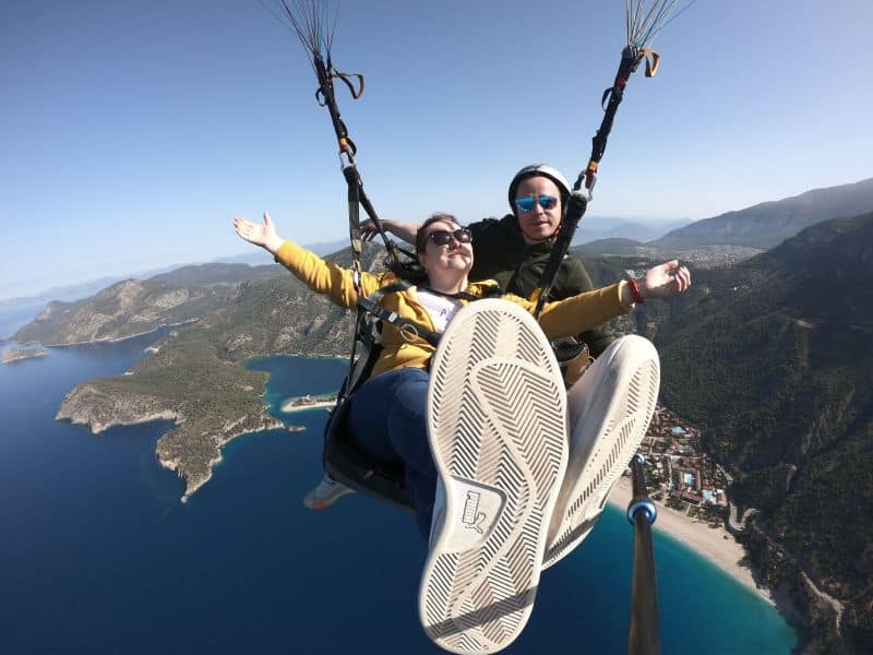 The girl in paragliding sea Oludeniz in Turkiye Paragliding v Turecku 